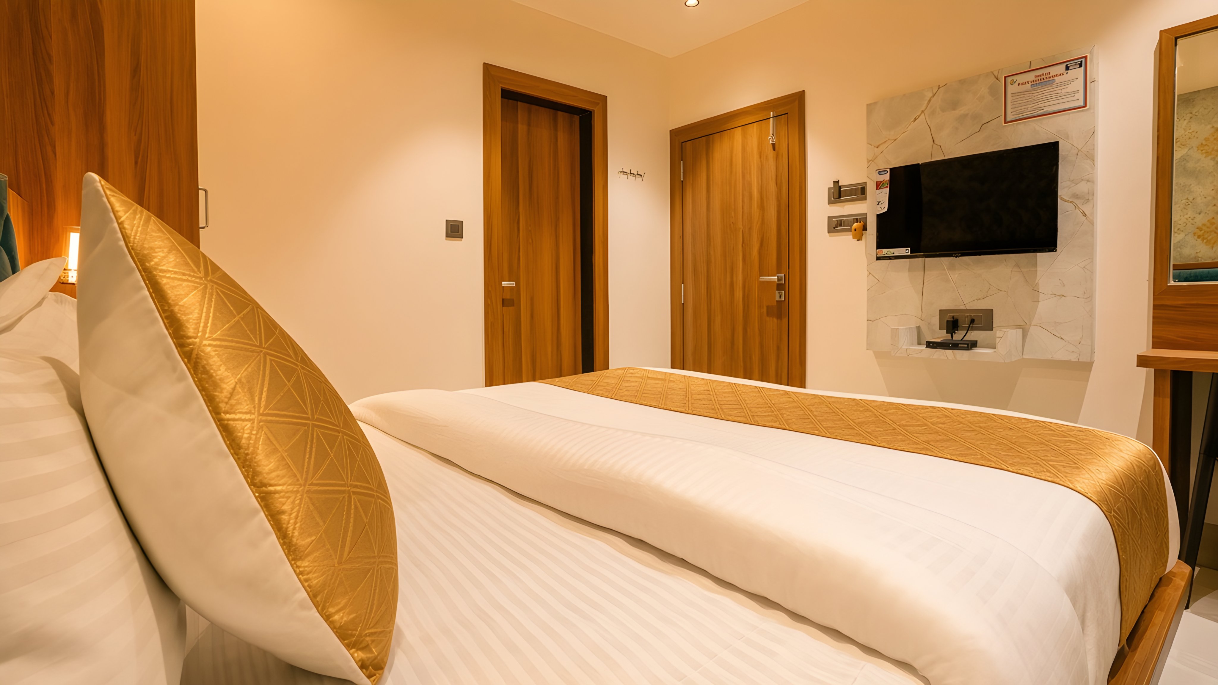 Gold cushion and the runner on a deluxe bed
